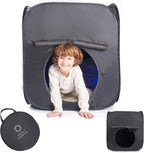 Child playing inside a gray sensory tent with a carrying case on a white background