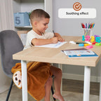 Child sitting at a desk with educational materials and a weighted lap sloth, with a 'Soothing effect' label.