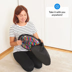 Woman holding a colorful sequin mat with text 'Take it with you anywhere!' on a white background