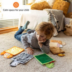 Child playing with educational sensory toys on a carpeted floor, with text 'Calm space for your child' in the background.