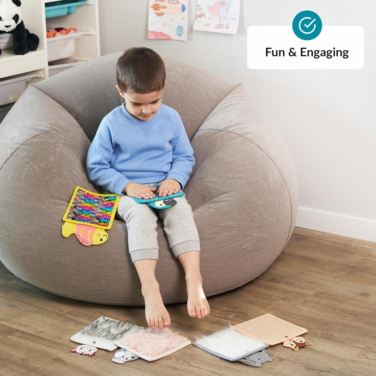 Child sitting on a bean bag with educational sensory toys around, in a room setting.