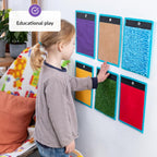 Child interacting with colorful educational wall panels in a home setting.