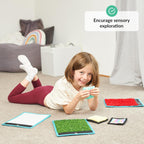Child playing with colorful mats on the floor, encouraging sensory exploration.