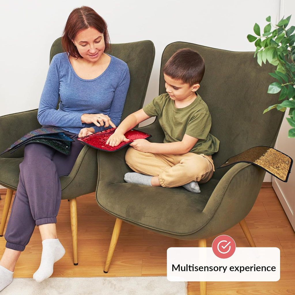 Woman and child sitting on a green couch, engaging with a red sensory wall tile, with a 'Multisensory experience' label.