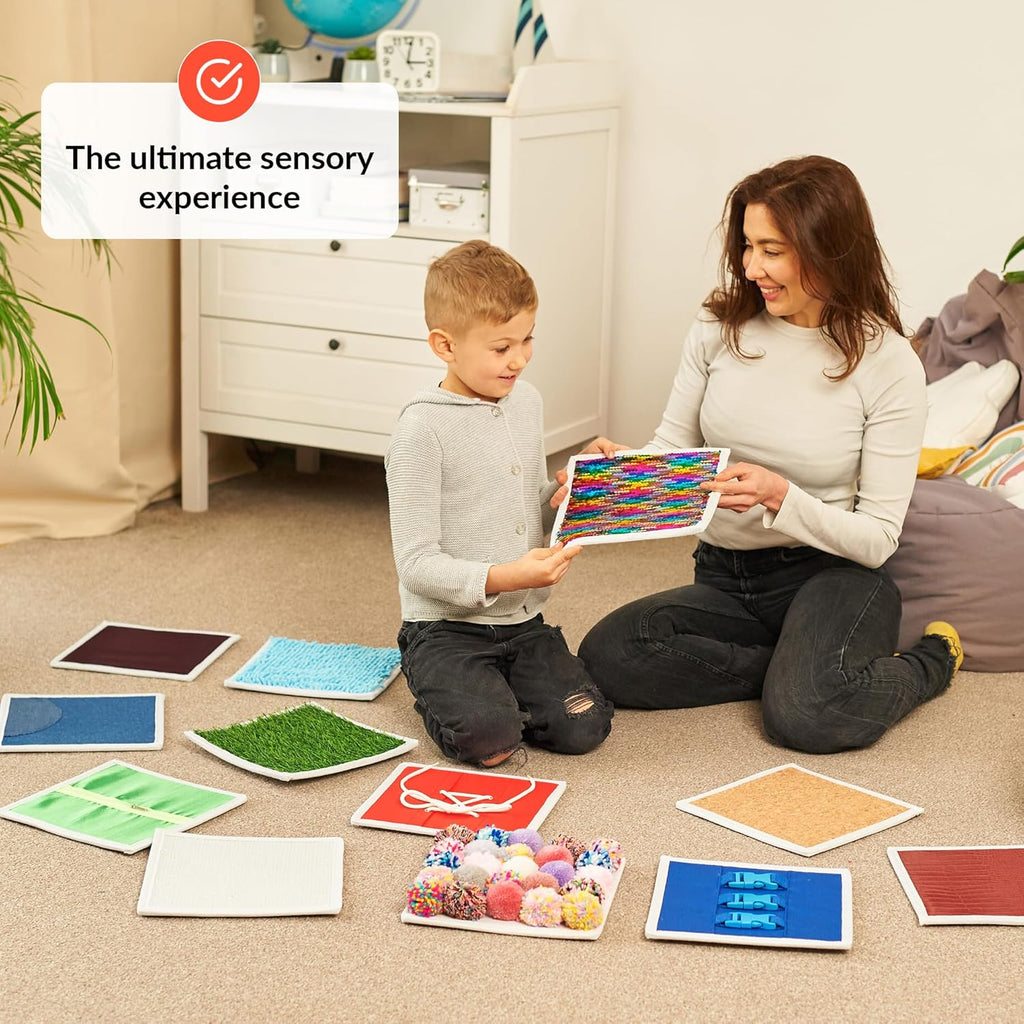 Woman and child playing with sensory materials on the floor in a home setting.