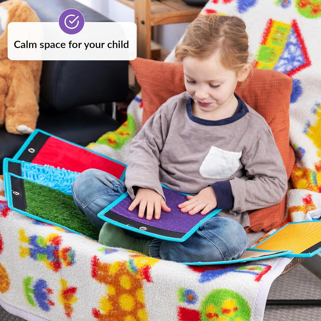 Child playing with a colorful mat with a calm space label above