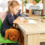 Child sitting at a desk with a lapdog, writing on paper, with text 'Improves focus and concentration'