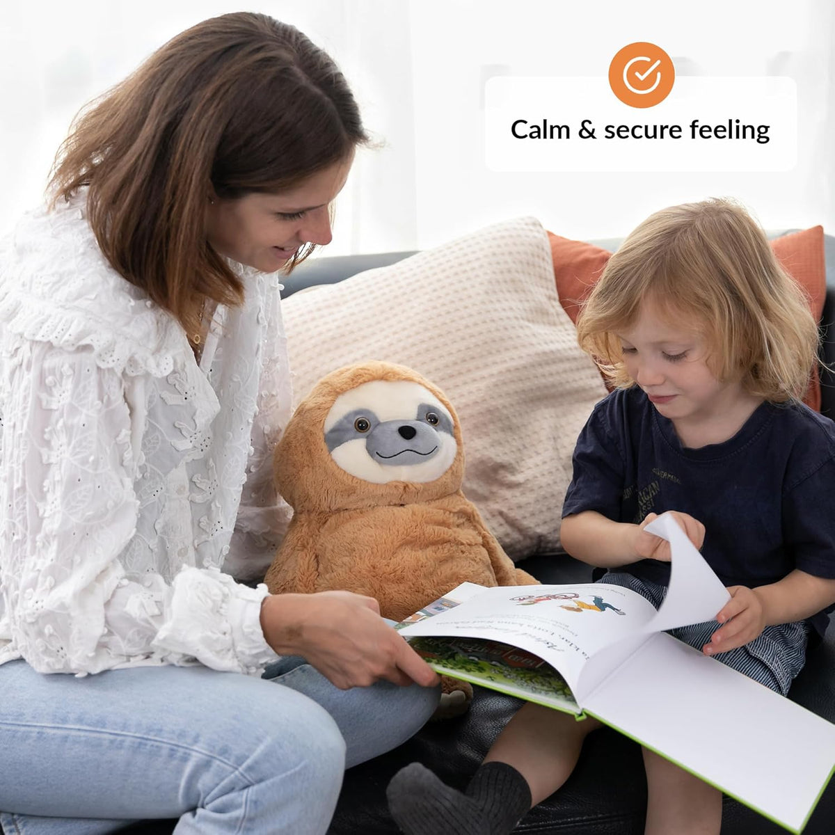 Woman and child reading a book together with a plush sloth toy on a couch, featuring the text 'Calm & secure feeling'.