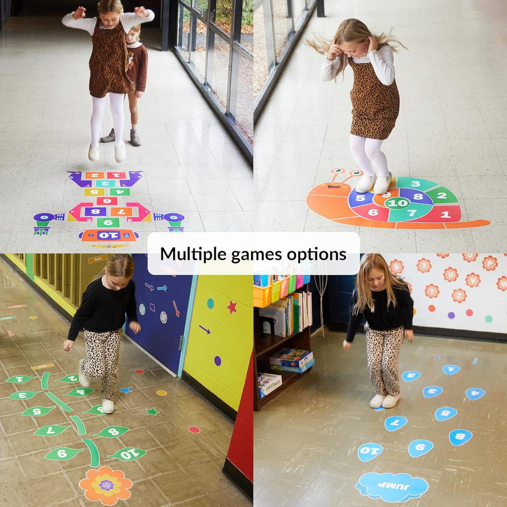 Children playing on colorful floor games in a classroom setting.