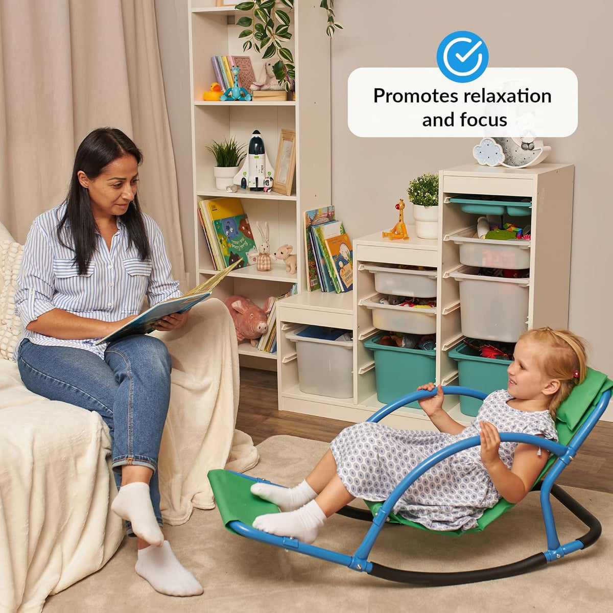 Woman reading to a child in sensory rocking chair in a home setting.