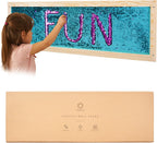 Child interacting with a sequin wall frame displaying the word 'FUN', with the brand packaging below.