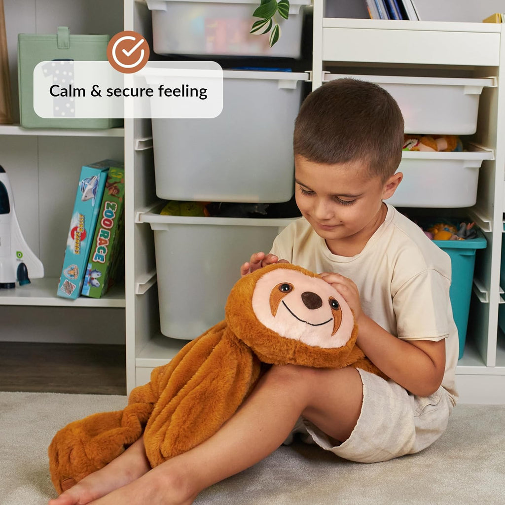 Child holding a plush sloth toy