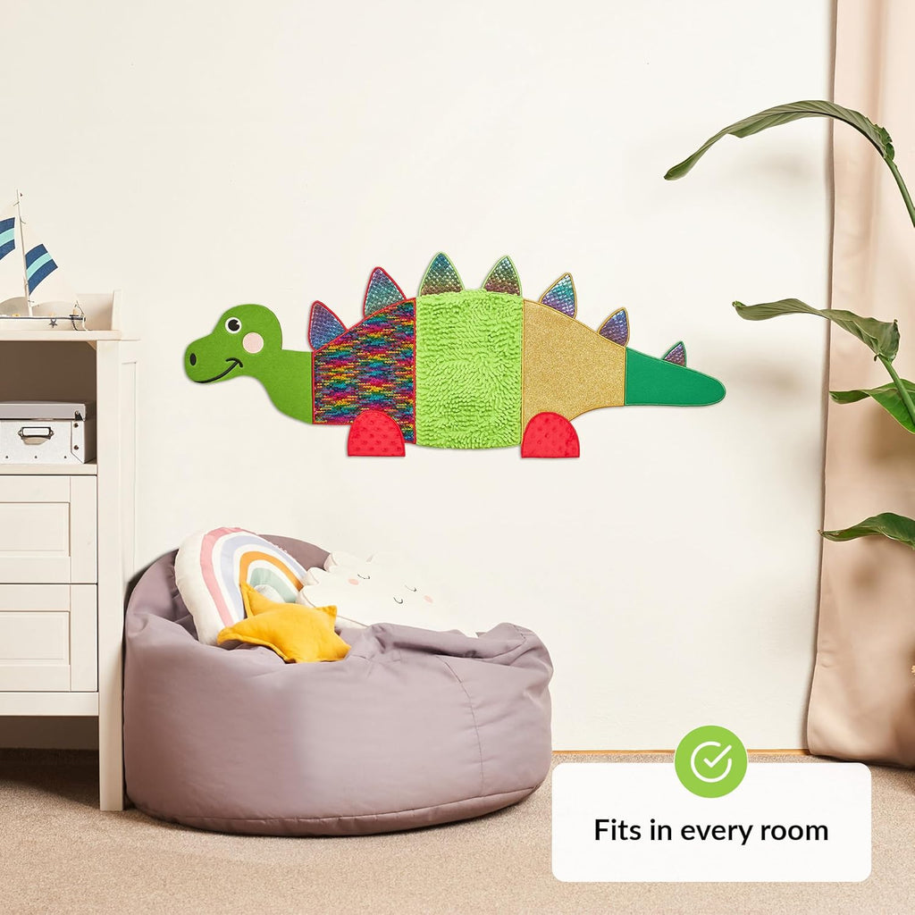 Children's room with a dinosaur wall decoration.