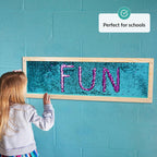 Child interacting with a sequins board displaying the word 'FUN' against a teal wall, with a label indicating it's 'Perfect for schools'.