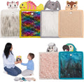 Collection of sensory wall tiles with animal designs and a woman and child interacting with one of them.